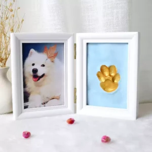 Kid creating paw print with puppy